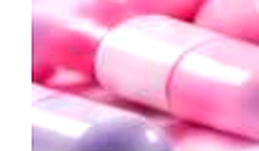 Pink and white pharmaceutical capsules